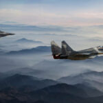 Mig-29 Fighter Jets in Flight above the fogy mountains